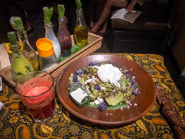 Bali Bunda Bowl with sunflower seeds, poached egg, and chicken