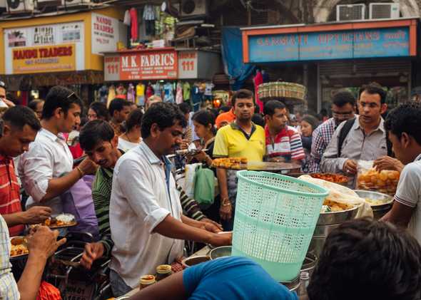 Street markets with mobs of people buying chaat (snacks)